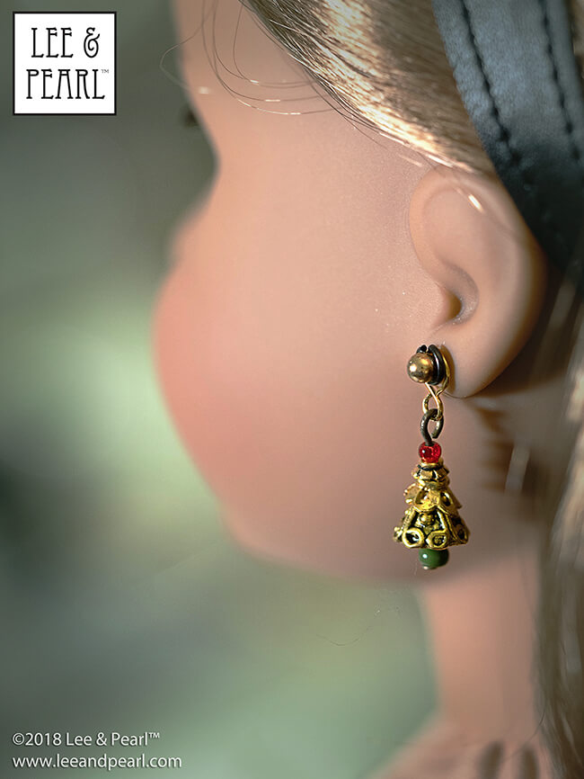 Dazzle them with doll jewelry gifts that are easy and fun to make, too! We'll help you amaze and delight the doll lovers in your life with beautiful and unique last-minute gifts — like these filagree Christmas tree earrings for 18 inch dolls, made using our newsletter tutorial and the techniques from our Jewelry Making for Vinyl Play Dolls eBook — available in our Etsy store at https://www.etsy.com/listing/601009838/lp-craft-guide-introduction-to-jewelry.