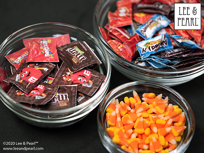Happy Halloween from Lee & Pearl! We’ve got a YUMMY addition to our doll confectionary tutorial series today. Follow along as we show you how to make wonderfully realistic 18 inch doll-size replicas of popular fun-size bagged candies like Skittles and M&Ms to go with our doll candy corn and fun-size candy bars.