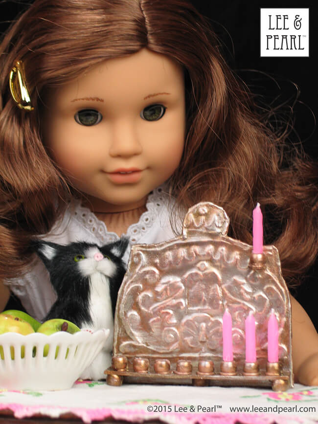 Happy Chanukah from Lee & Pearl! Make your 18 inch doll, like our American Girl® Rebecca Rubin, her very own pressed metal Chanukah Menorah (Chanukiya) using a dollar store cookie sheet, cardboard, glue, plastic beads, a knitting needle, metallic paints and the techniques in our easy VIDEO TUTORIAL.