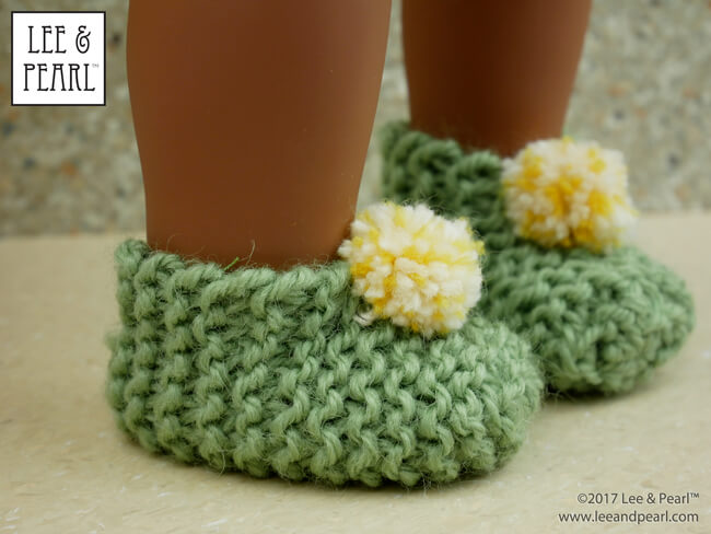 It's Day Four of Lee & Pearl Cyber Week, and we have lots of doll treats for you — a round-up of all our previous Christmas and Chanukah holiday crafts, like these super-cute and super-easy knitted slippers for 18 inch American Girl® dolls.