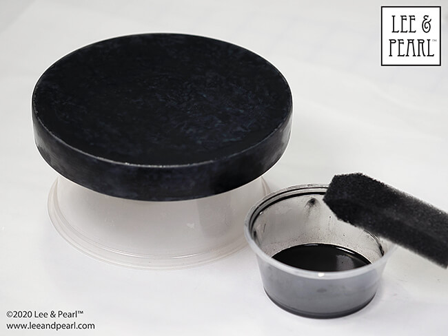 Here's a fun Halloween tutorial — follow our step-by-step directions to paint your own faux soapstone tabletop for dolls, just like the one we made for the Lee & Pearl Mad Scientist Laboratory extravaganza!