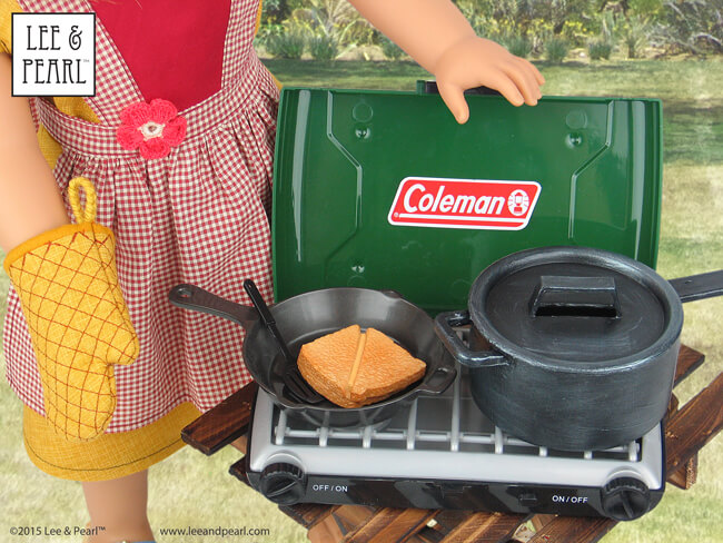 We love this ultra-realistic, 18” doll Coleman® camp stove from Sophia’s.It comes with plenty of food and a nifty saucepan, but we thought it needed a matching cast iron pot — so we made one! Our new pot (on the right) started out as a plastic dollar store toy. But you'd never know after our realistic paint job. For this easy “cast iron” paint tutorial, visit the July 2015 Newsletter in the Lee & Pearl Newsletter Archive at http://www.leeandpearl.com/newsletters.html
